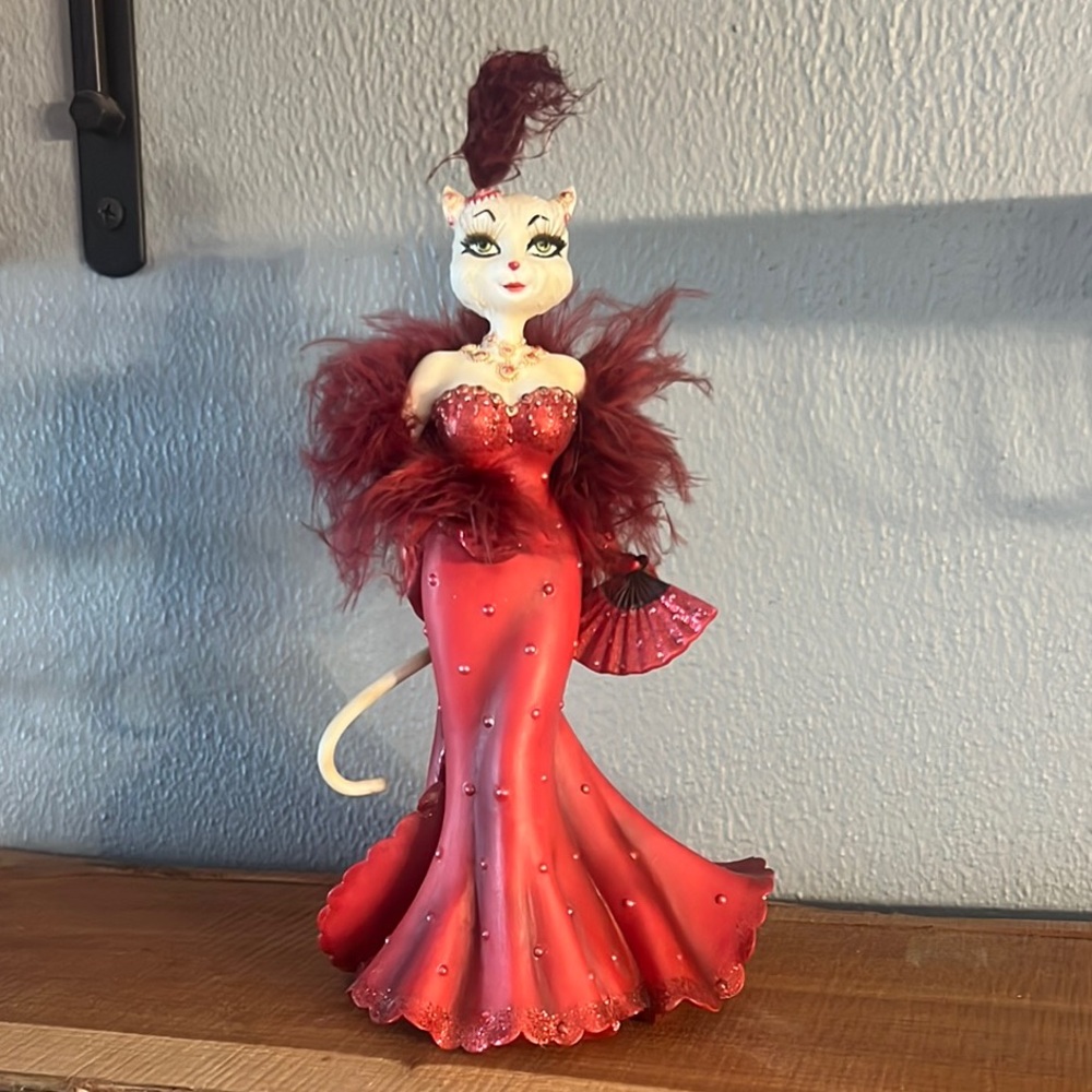 Elegant Red Cat Figurine with Feathers